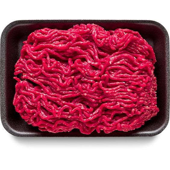 Raw ground beef in a black foam tray on a white background
