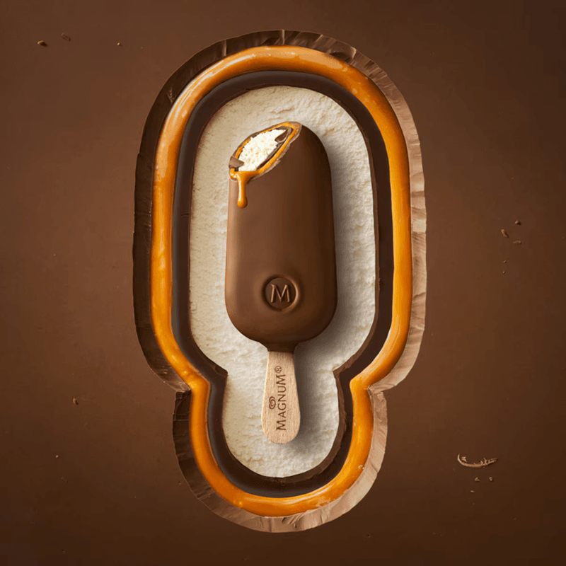 Magnum chocolate ice cream bar in a layered chocolate and caramel shell shaped like the bar