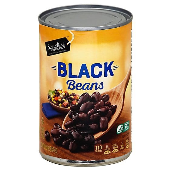 Signature Select Black Beans can with a wooden spoon scooping beans and a bowl of salsa.
