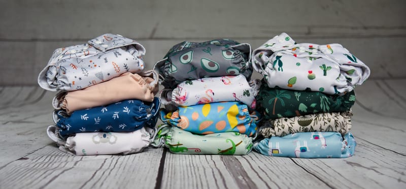 a stack of diapers with different designs on them