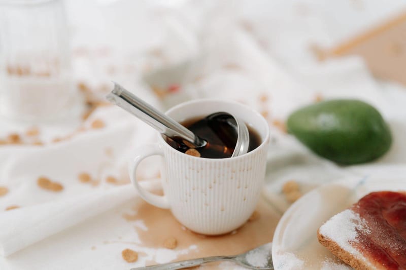 a cup of coffee with a spoon in it